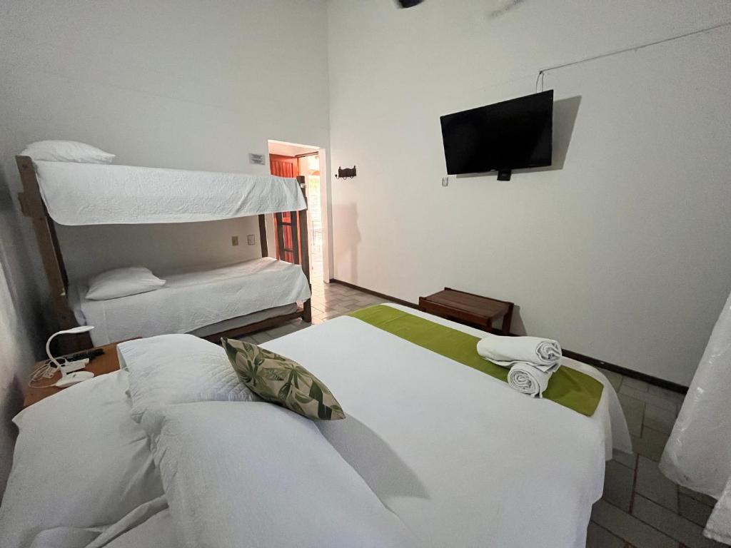 Postel nebo postele na pokoji v ubytování Coral House SAI