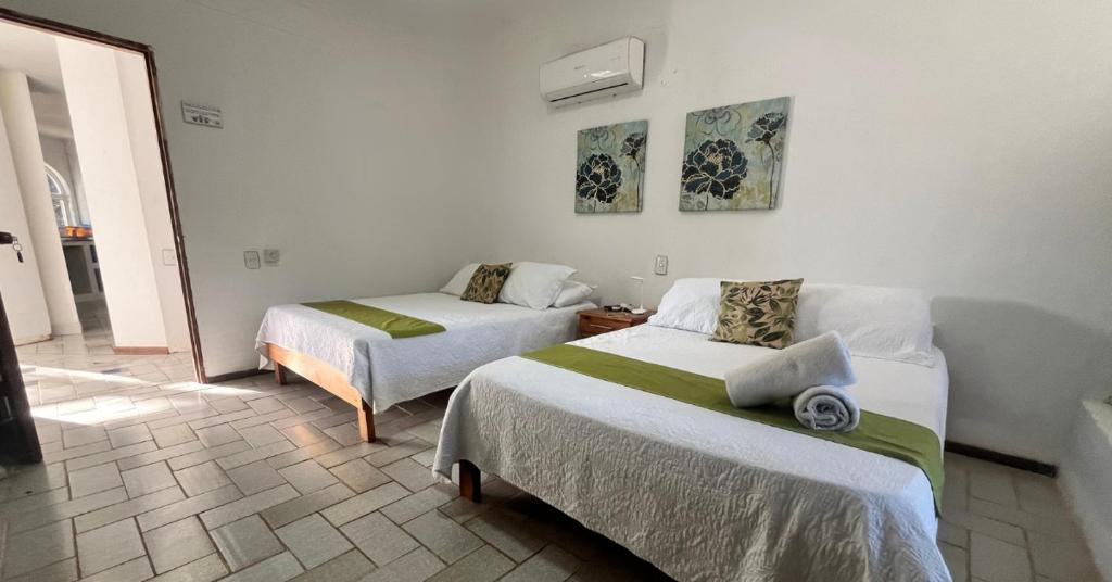 Postel nebo postele na pokoji v ubytování Coral House SAI
