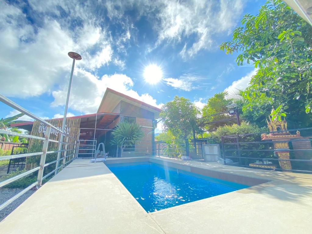 a swimming pool in front of a house at De'Sister Pool Villa Hatyai in Ban Tha Nang Hom (1)