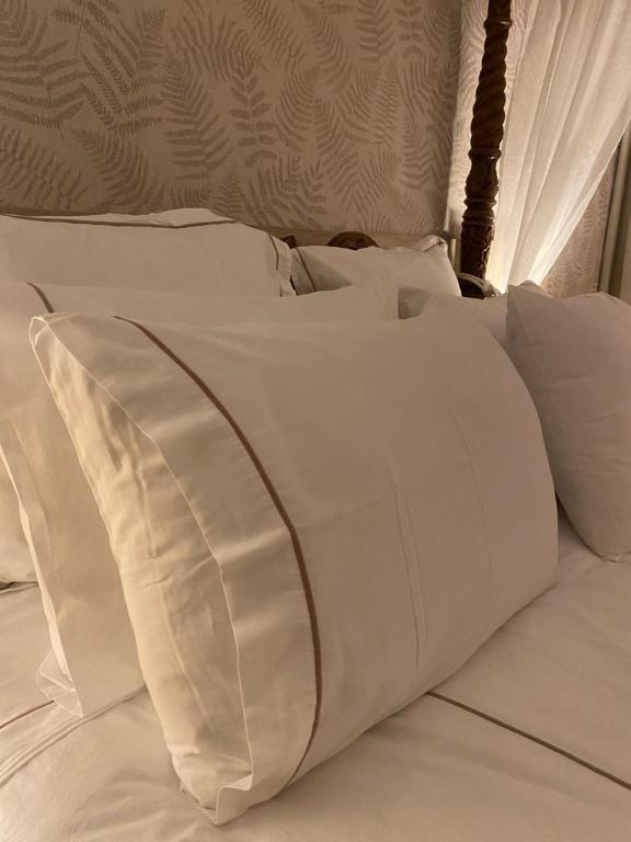 Uma cama ou camas num quarto em Hotel Lusitano