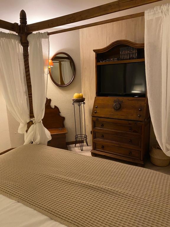 Uma cama ou camas num quarto em Hotel Lusitano