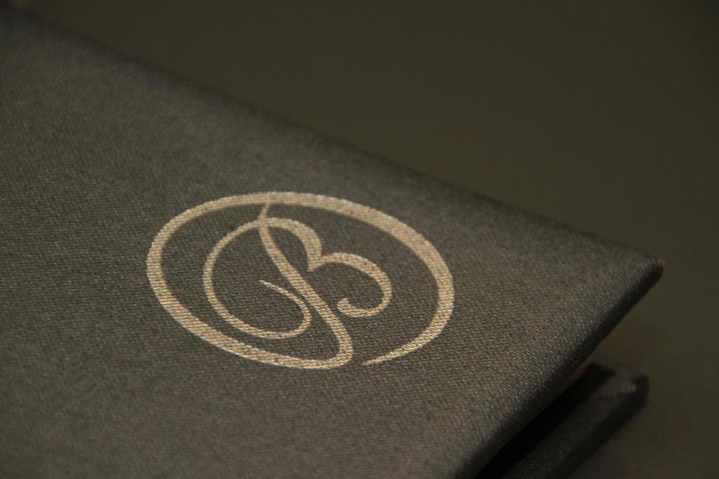 a logo on the side of a laptop computer at Bentleys Motor Inn in Palmerston North