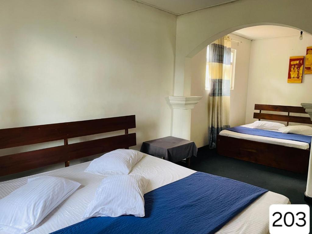 Postel nebo postele na pokoji v ubytování Sky Beam Hotel