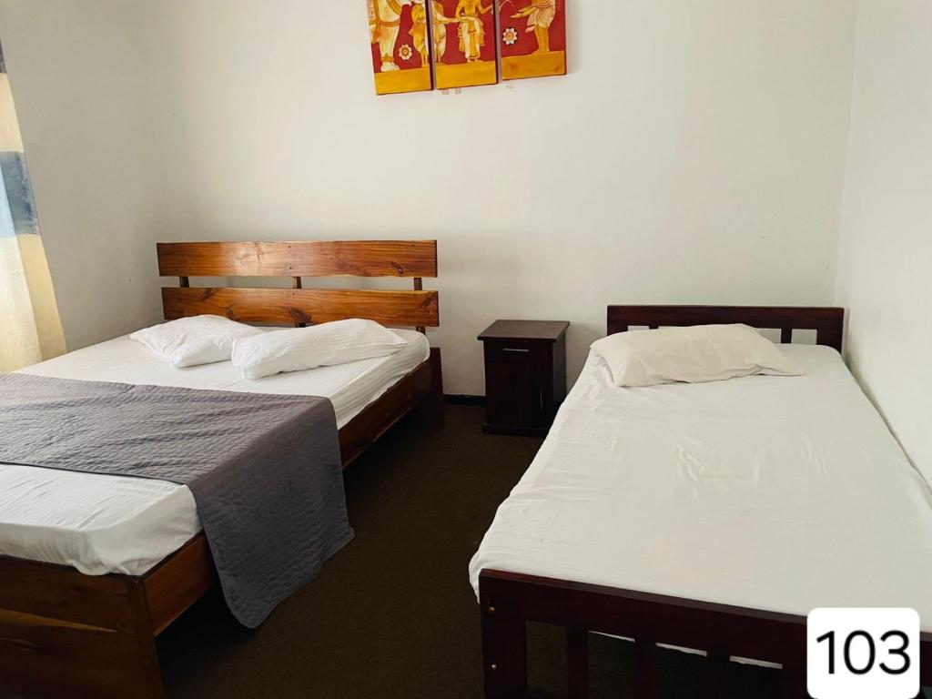 Postel nebo postele na pokoji v ubytování Sky Beam Hotel