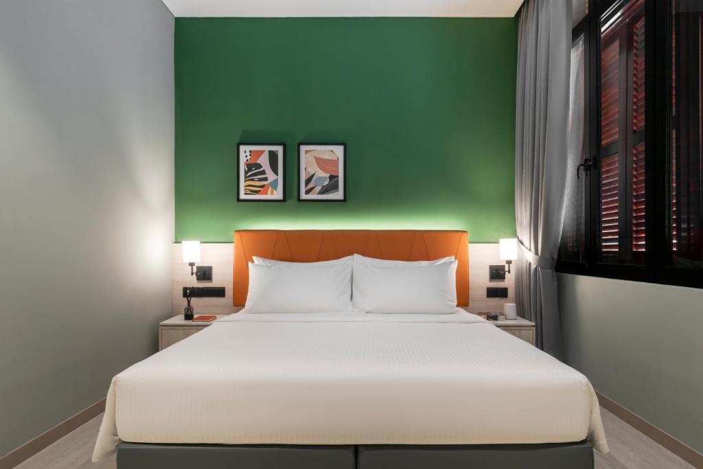 Postel nebo postele na pokoji v ubytování Citadines Connect Georgetown Penang