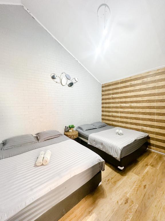 Postel nebo postele na pokoji v ubytování Otu Hostel By Ostic