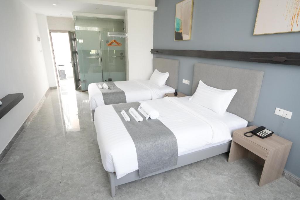 Postel nebo postele na pokoji v ubytování Bohol Panglao Begonia Resort