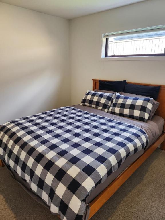 Postel nebo postele na pokoji v ubytování RemarkableStay