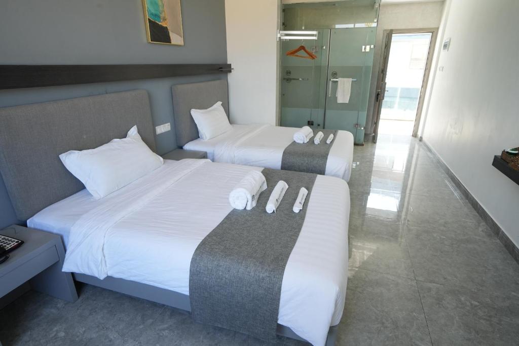 Postel nebo postele na pokoji v ubytování Bohol Panglao Begonia Resort