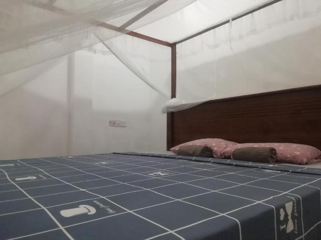 Postel nebo postele na pokoji v ubytování Kodi Beach Home