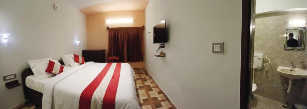 Koupelna v ubytování Ponmurugan Residency