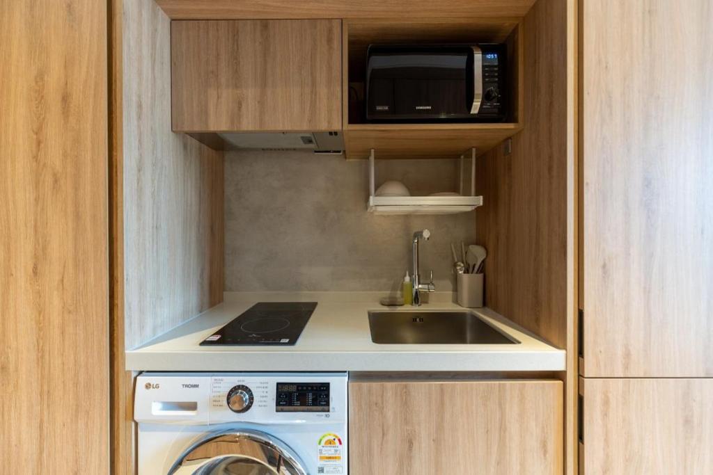 Kuchyň nebo kuchyňský kout v ubytování Homes Stay Myeongdong