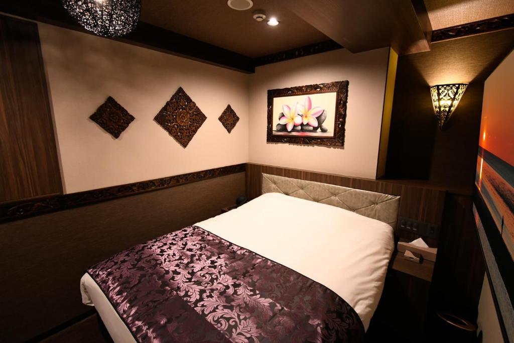 Postel nebo postele na pokoji v ubytování Hotel BaliBali ANNEX 五反田