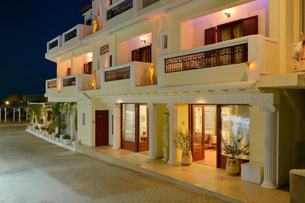 a large building with a lot of windows at Agistri Hotel in Skala