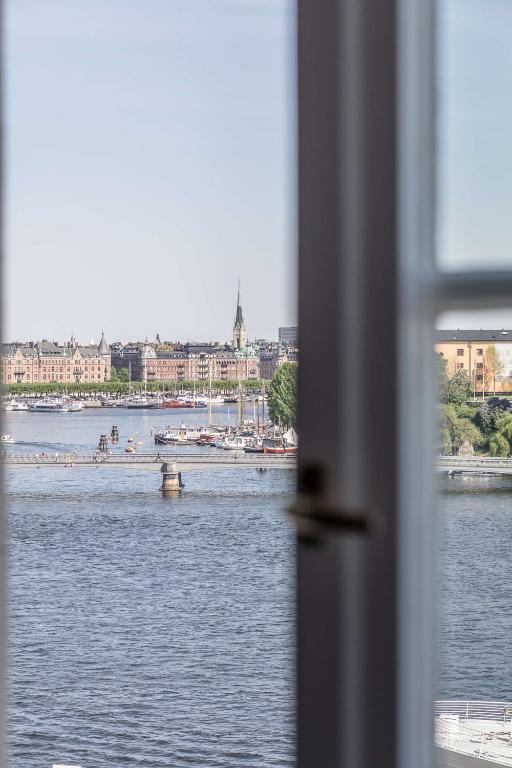 a view of a river with a city in the background at Hôtel Reisen in The Unbound Collection by Hyatt in Stockholm