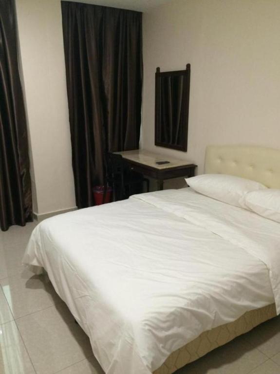 Postel nebo postele na pokoji v ubytování Sam Hotel