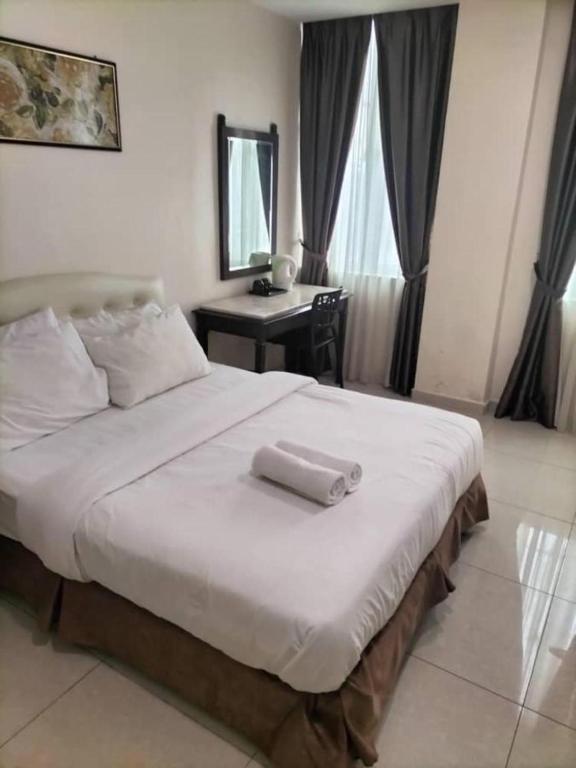 Postel nebo postele na pokoji v ubytování Sam Hotel