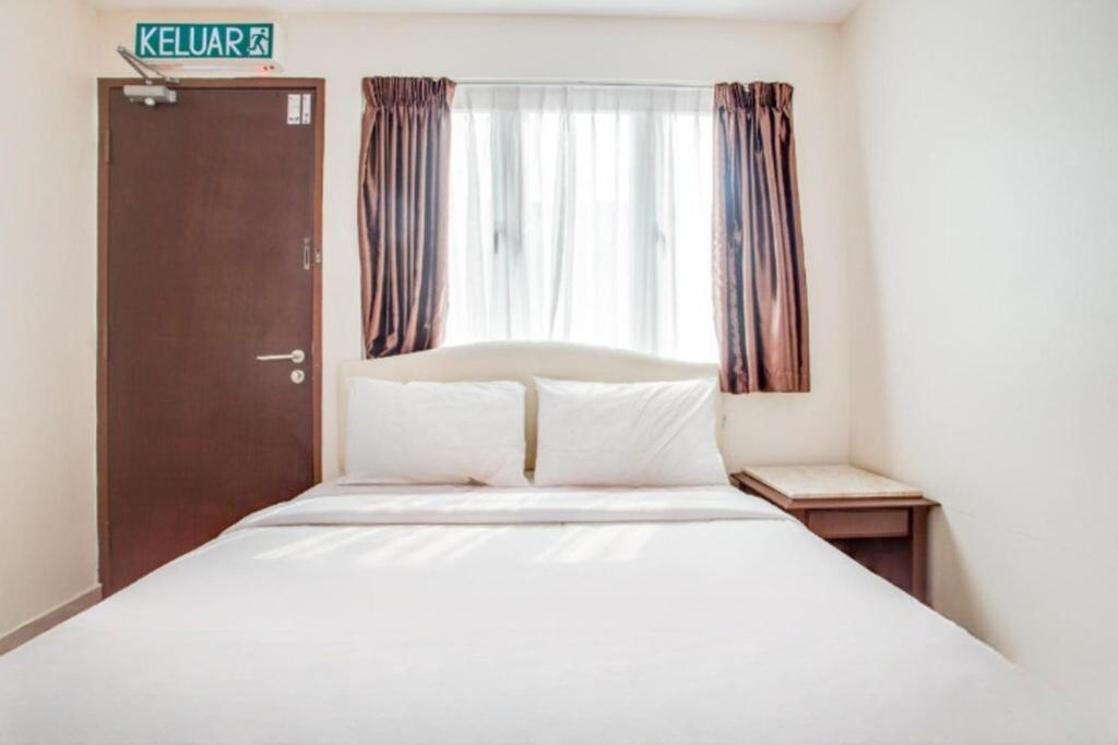 Postel nebo postele na pokoji v ubytování Sam Hotel