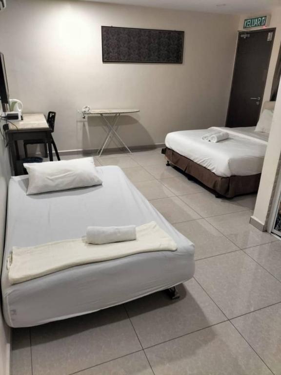 Postel nebo postele na pokoji v ubytování Sam Hotel