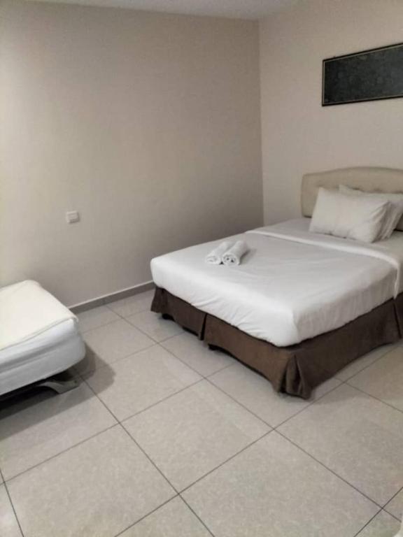 Postel nebo postele na pokoji v ubytování Sam Hotel