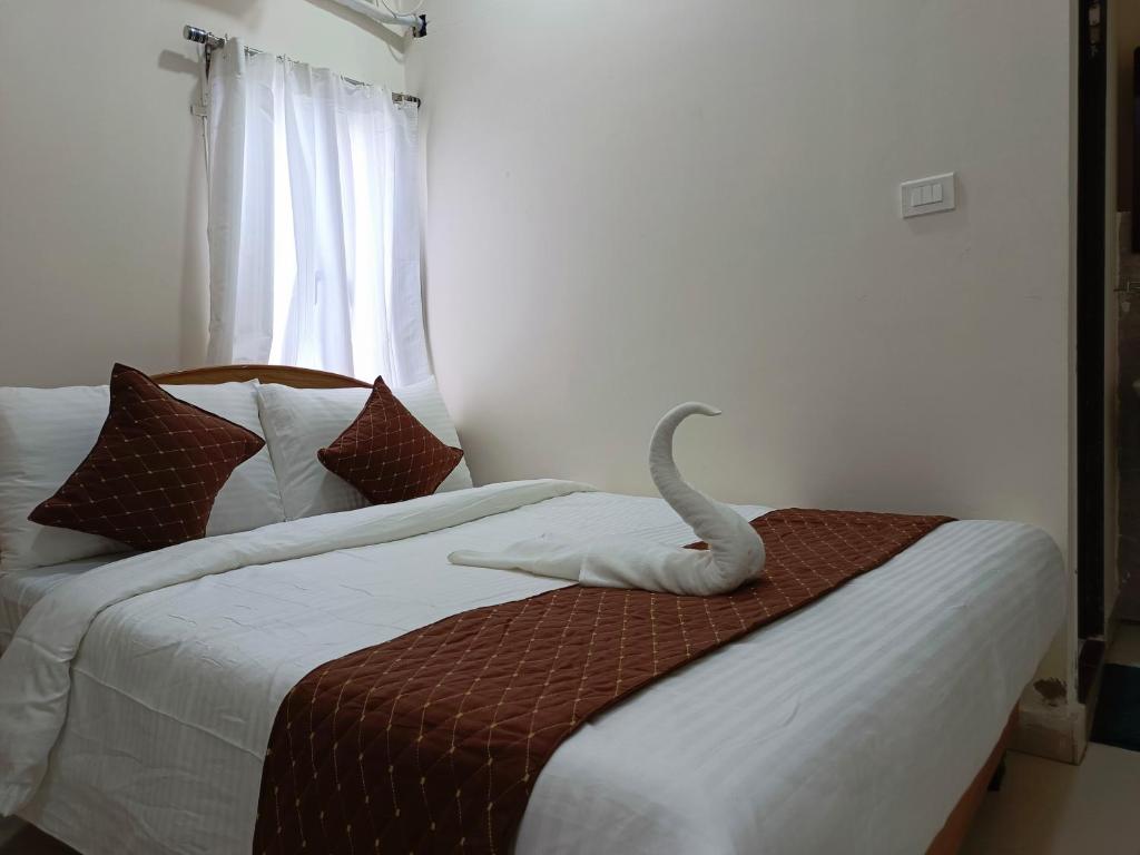 Postel nebo postele na pokoji v ubytování SM Residency
