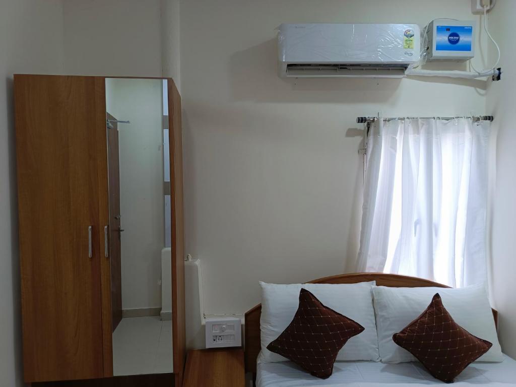 Postel nebo postele na pokoji v ubytování SM Residency