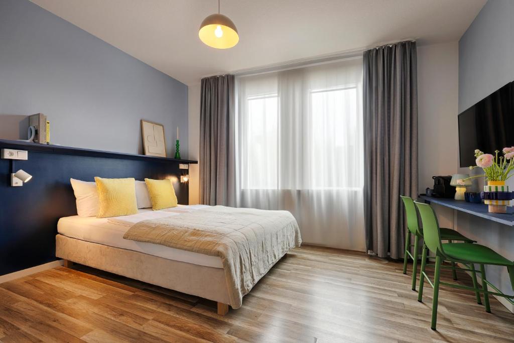 Postel nebo postele na pokoji v ubytování Max Aparthotel in Fürth