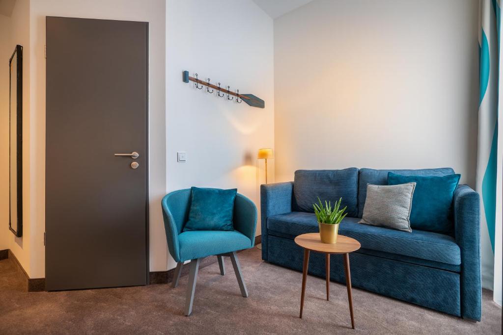 Posezení v ubytování Hotel Hansestadt Lübeck