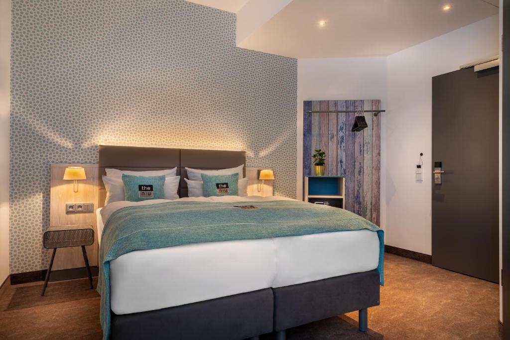 Postel nebo postele na pokoji v ubytování Hotel Hansestadt Lübeck