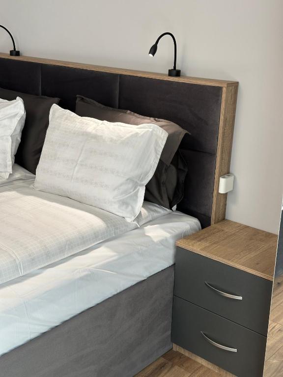 Postel nebo postele na pokoji v ubytování Vimar Apartments