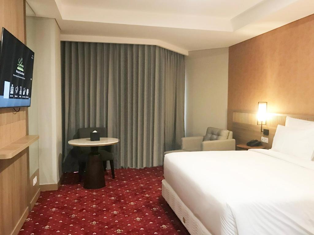TV a/nebo společenská místnost v ubytování Labersa Hotel & Convention Center Samosir