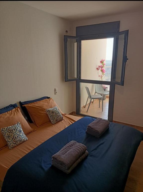 Llit o llits en una habitació de Les Oliviers