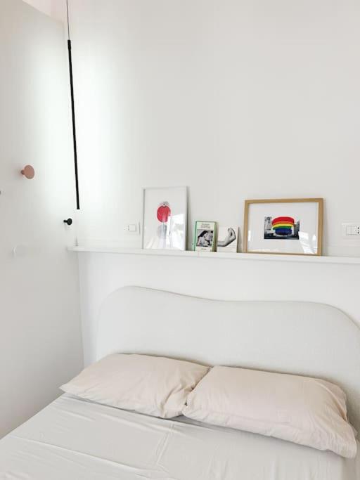 Postel nebo postele na pokoji v ubytování Civico 21 living - Tuscan loft