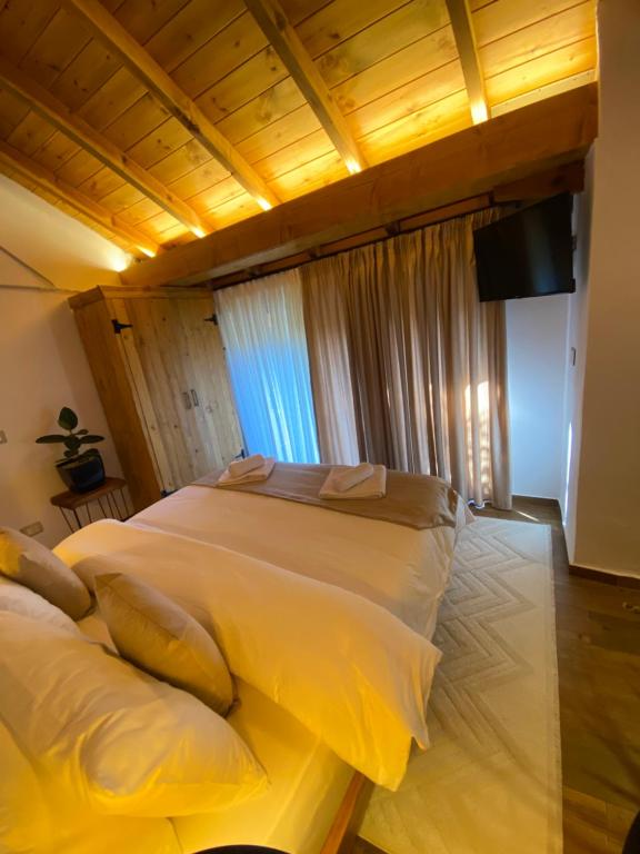 Postel nebo postele na pokoji v ubytování Vileta Auri
