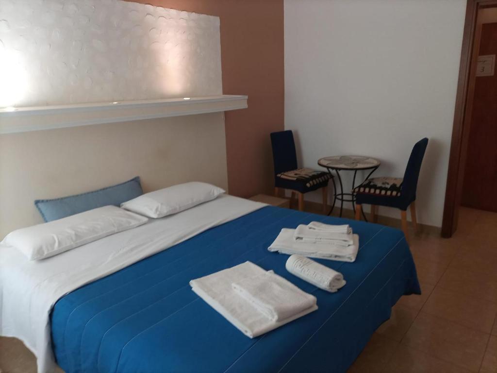 Postel nebo postele na pokoji v ubytování Harmony Central