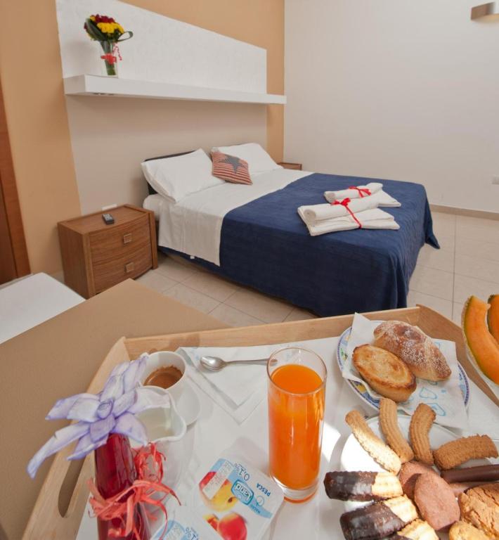 Postel nebo postele na pokoji v ubytování Harmony Central
