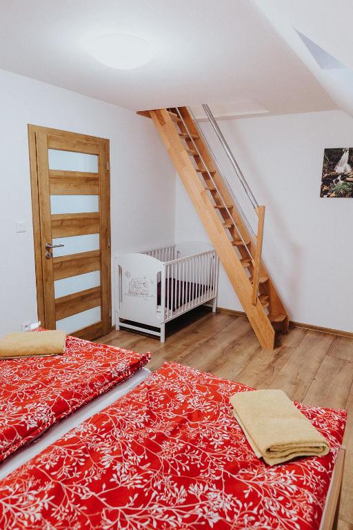 Postel nebo postele na pokoji v ubytování Apartmány Paľovci