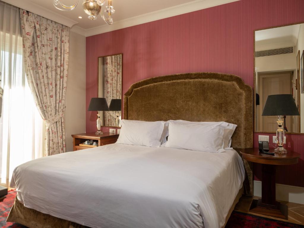 Postel nebo postele na pokoji v ubytování Ebel Boutique Hotel