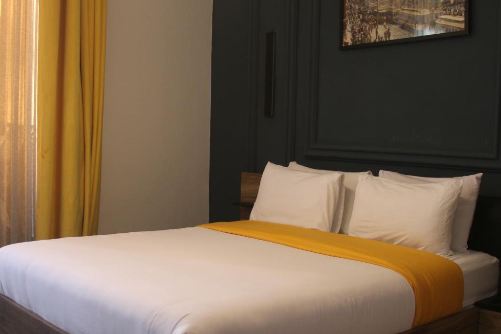 Postel nebo postele na pokoji v ubytování The Hotel Syracuse