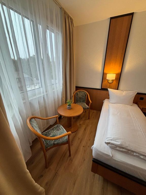 Postel nebo postele na pokoji v ubytování E&D Hotel Rodgau