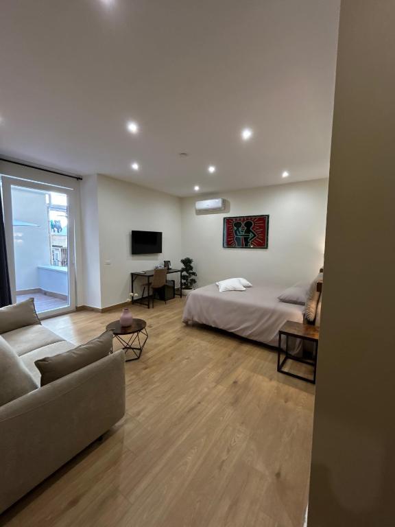 Postel nebo postele na pokoji v ubytování Somnia Luxury Rooms