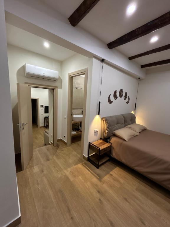 Postel nebo postele na pokoji v ubytování Somnia Luxury Rooms