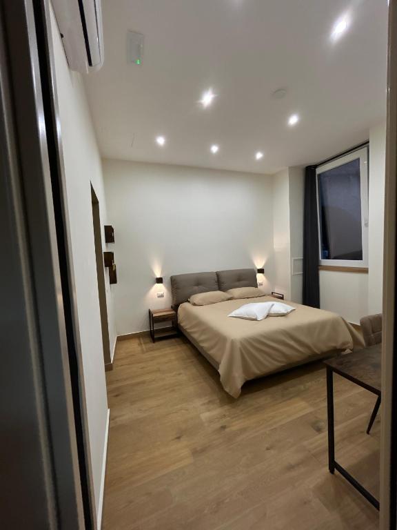 Postel nebo postele na pokoji v ubytování Somnia Luxury Rooms