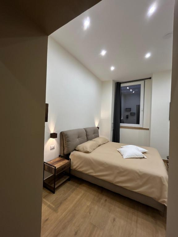 Postel nebo postele na pokoji v ubytování Somnia Luxury Rooms