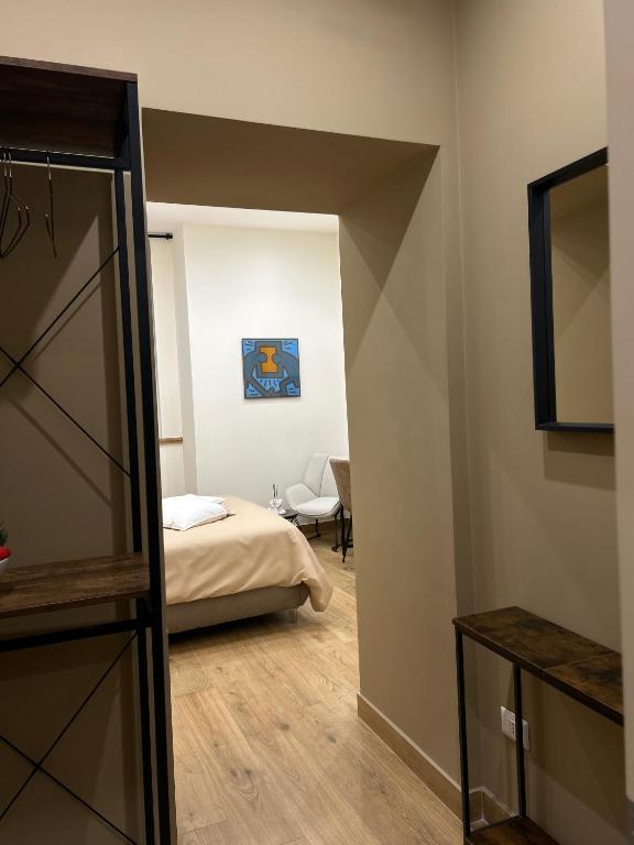 Postel nebo postele na pokoji v ubytování Somnia Luxury Rooms