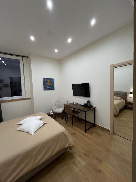 Postel nebo postele na pokoji v ubytování Somnia Luxury Rooms