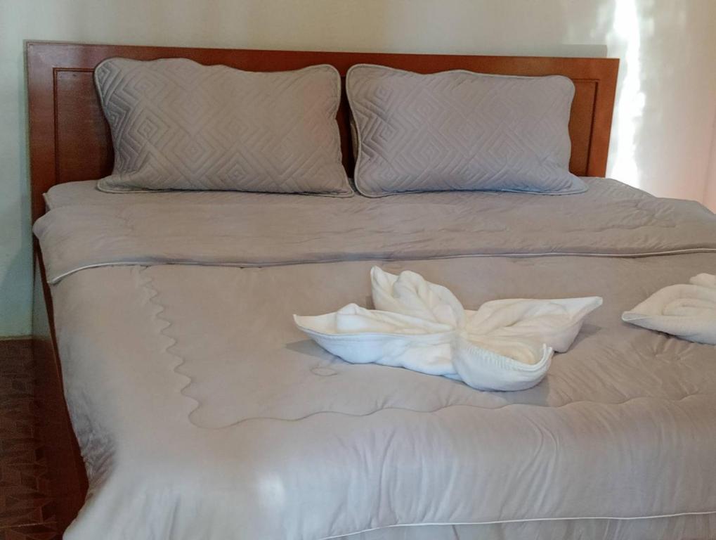 Postel nebo postele na pokoji v ubytování YAKAH BUNGALOWS By WILAI