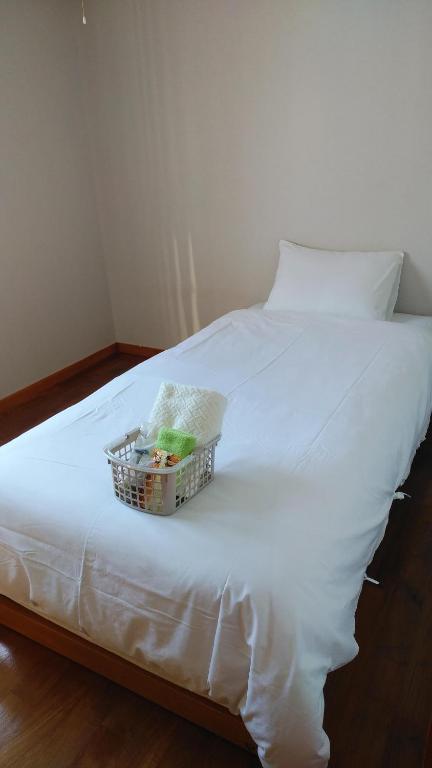 Llit o llits en una habitació de リンゴテラス壺屋