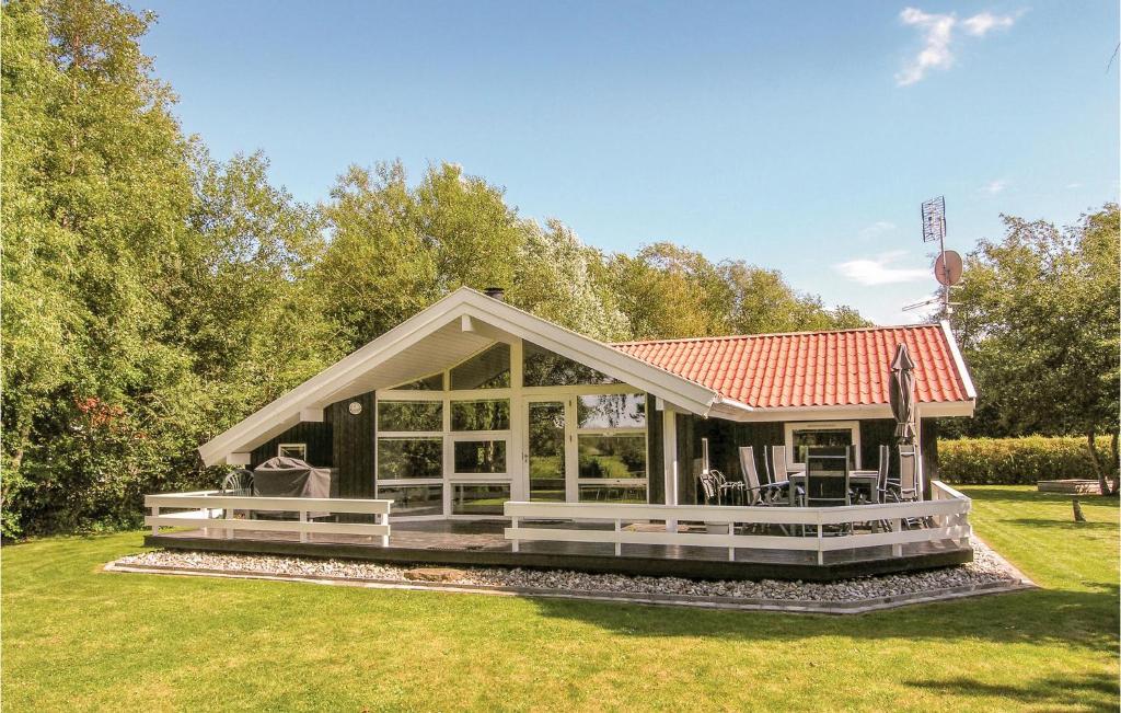 a house with a wrap around porch with a roof at Holiday Home Humble 34 With Hot Tub in Humble