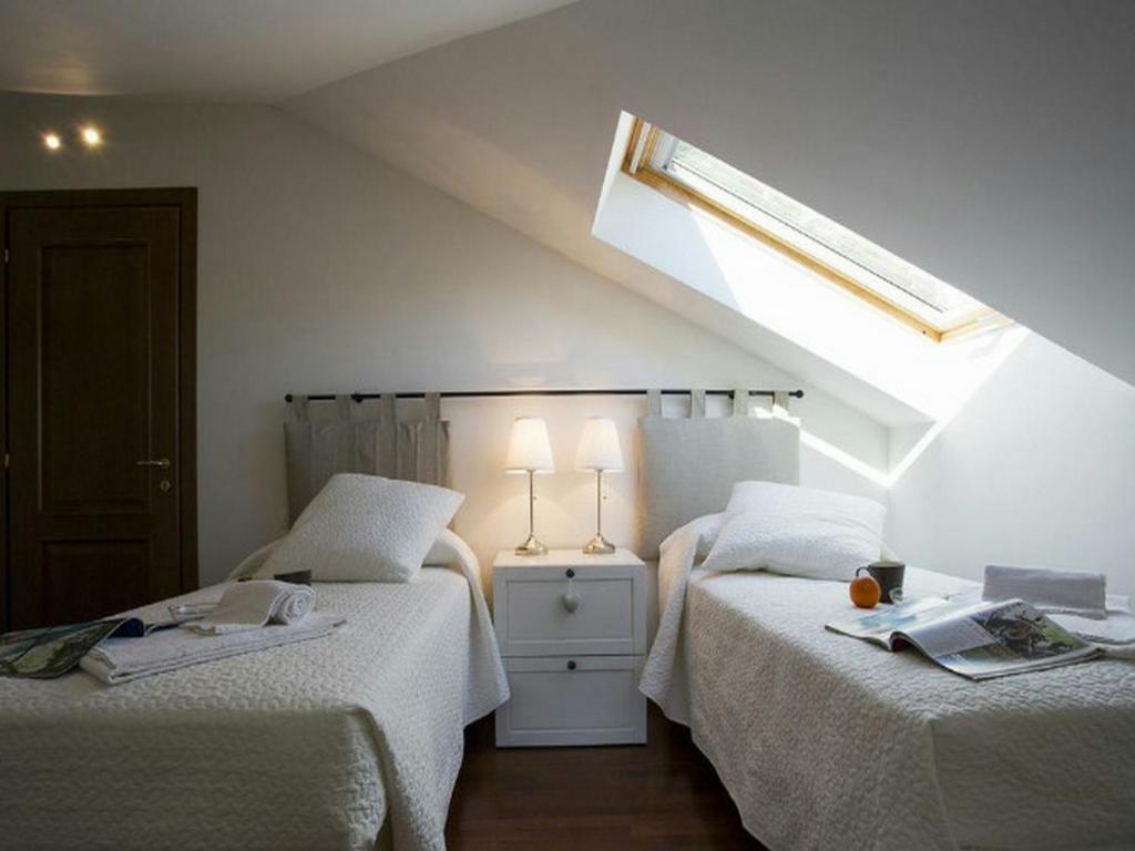 Łóżko lub łóżka w pokoju w obiekcie Casa Al Prato Apt. F